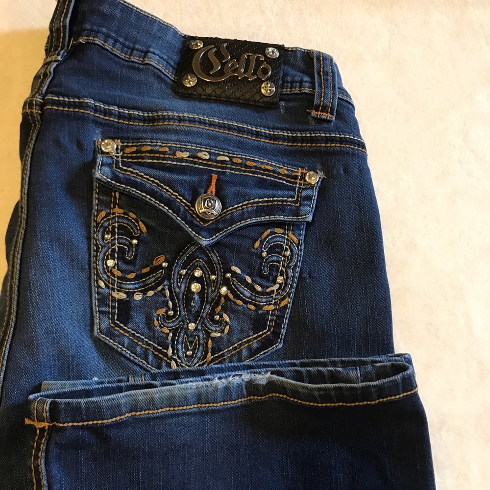 Cello distressed boot cut jeans.